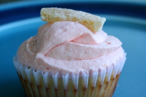 ginger cupcake with cream cheese frosting, topped with candied ginger