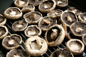 mushrooms on a stove-top grill